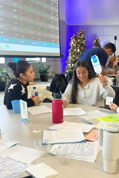 Student holds up paddle